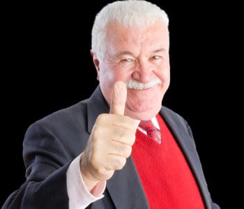 business man smiles and gives a thumbs up